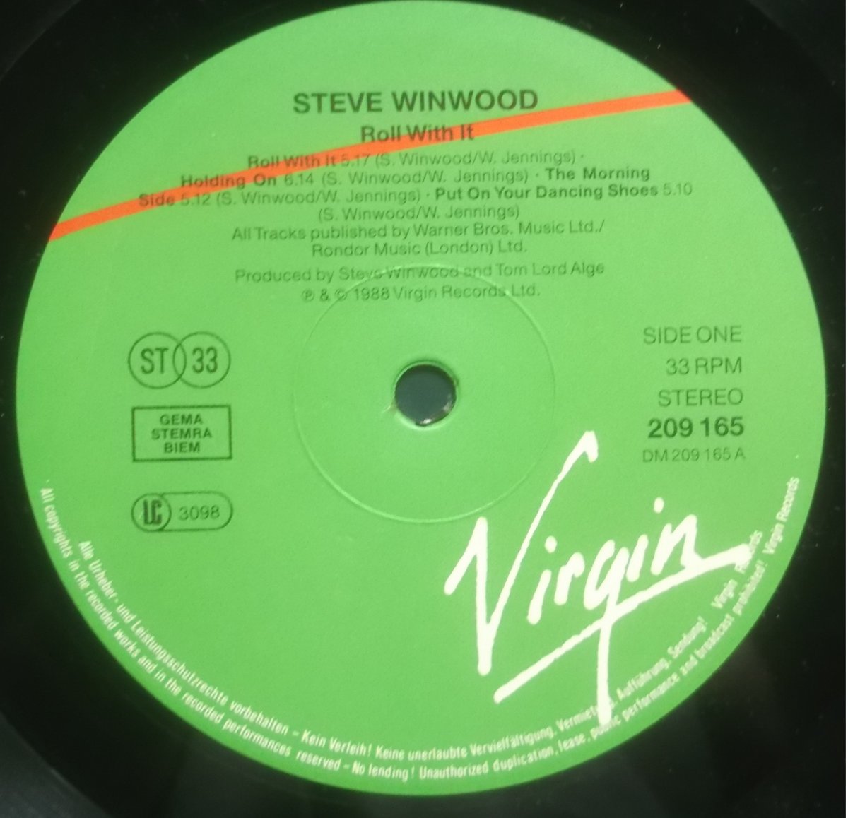Steve Winwood – Roll With It